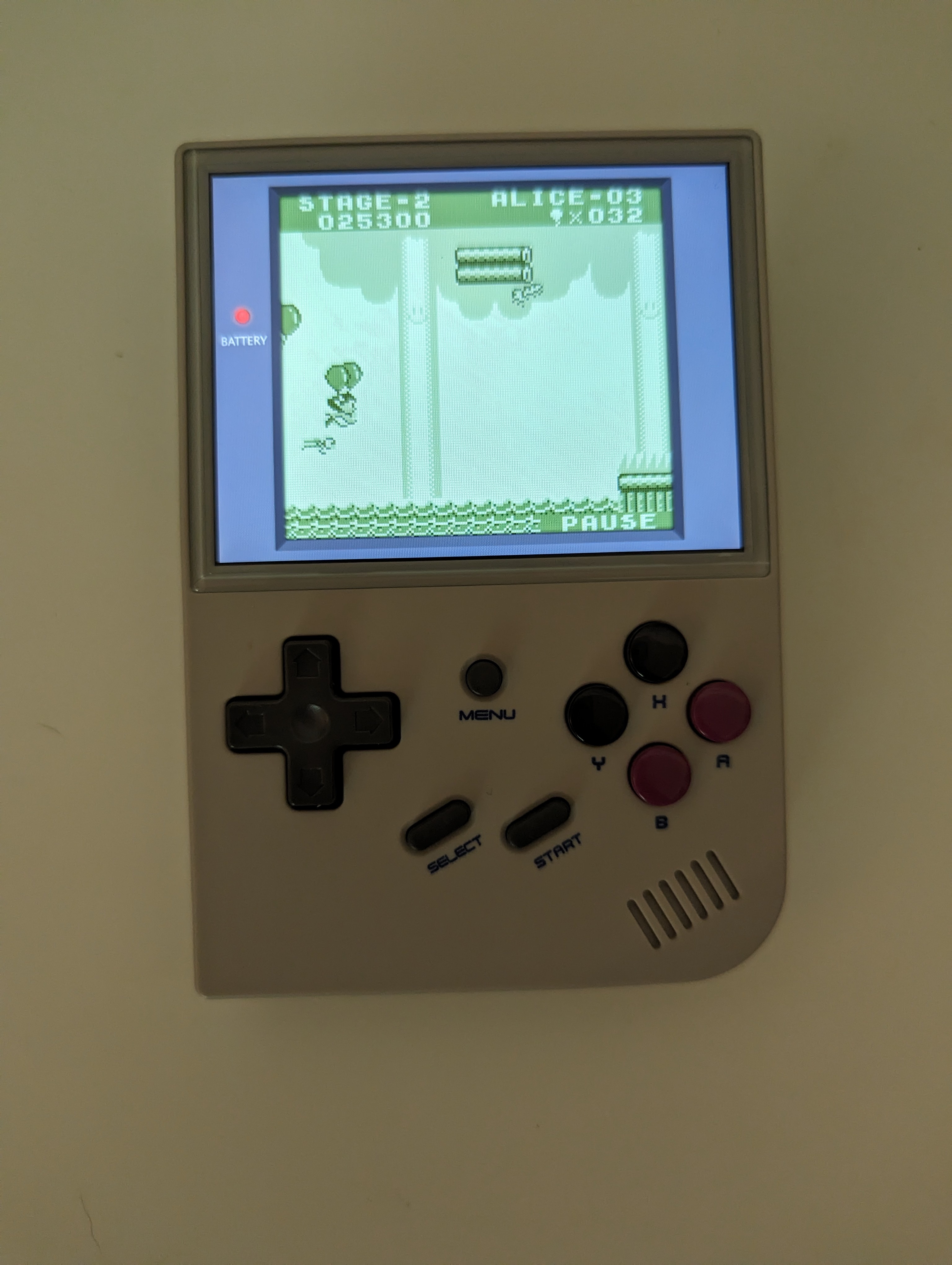 An RG35xx with Balloon Kid playing